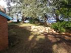 Area behind pump house left clean and tidy with logs piled as per instructions